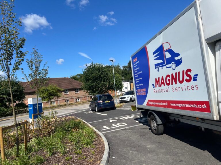 Branded Magnus Removals box van parked on a residential road