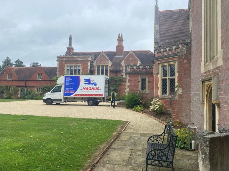 Magnus Removals van outside a period red-brick building
