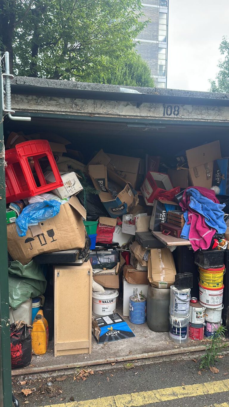 Garage full of unwanted items before a clearance