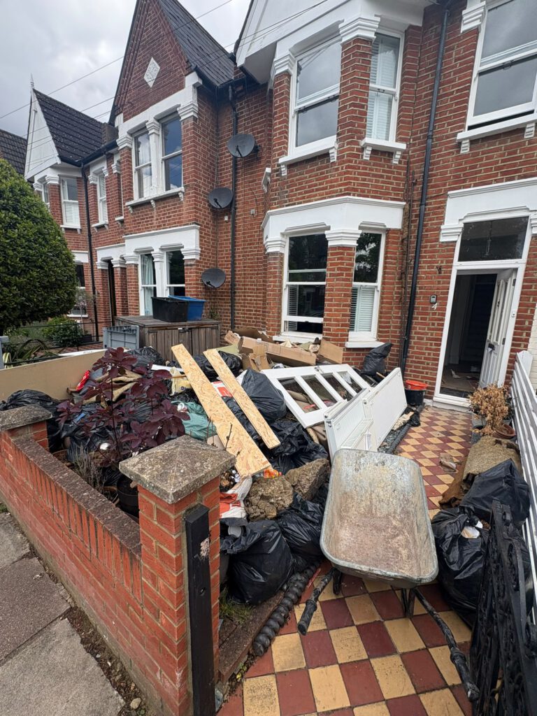 Front garden with waste awaiting clearance