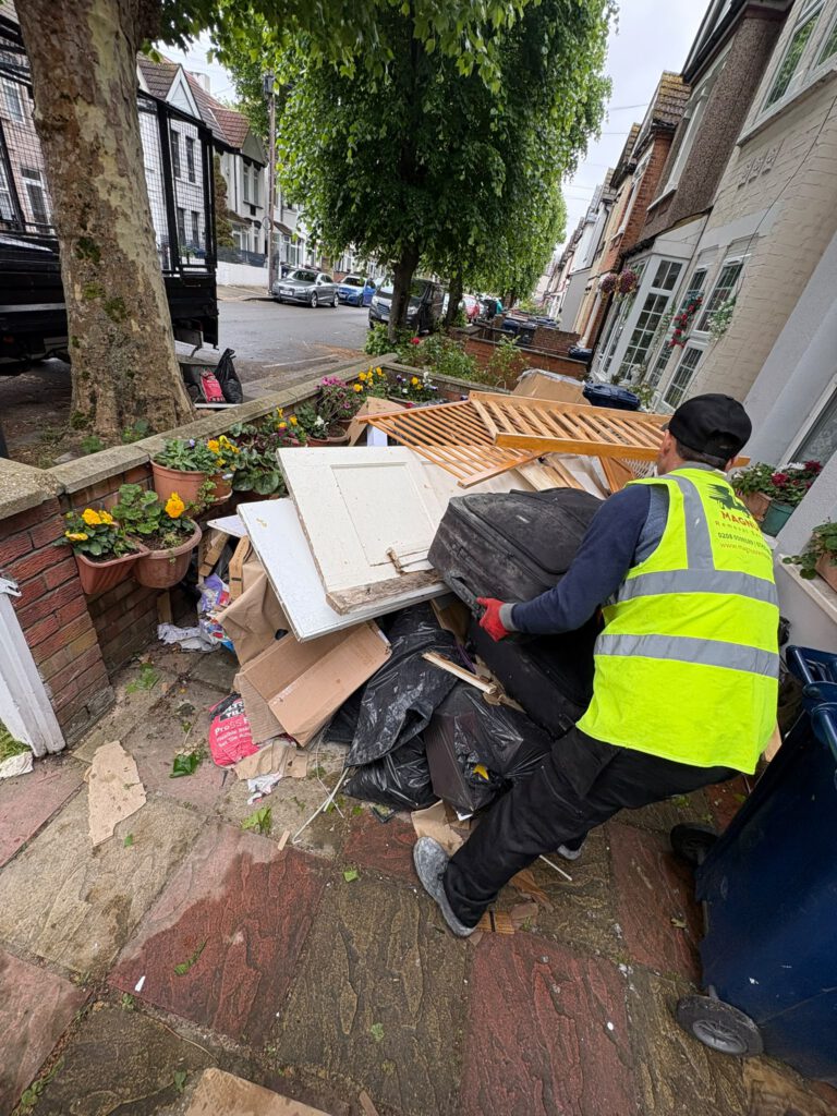 Magnus team member loading garden furniture and waste