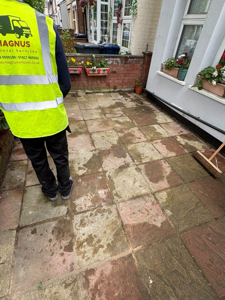 Magnus team member on a cleared patio