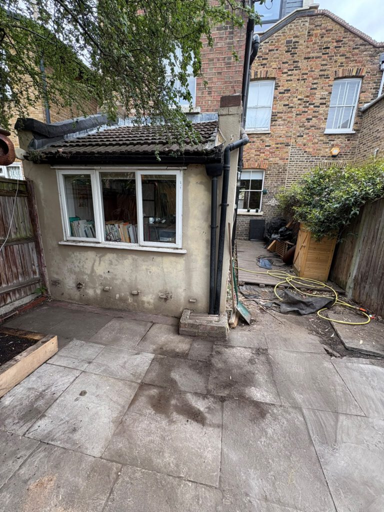Patio and outbuilding cleared after rubbish removal