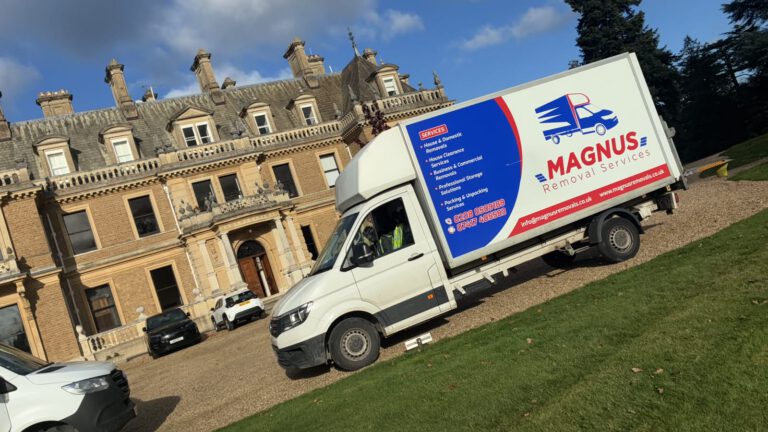 Magnus Removals van parked outside a large period house